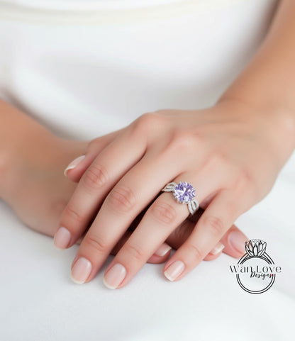 A close-up of a person's hand wearing a ring with a large purple gemstone.