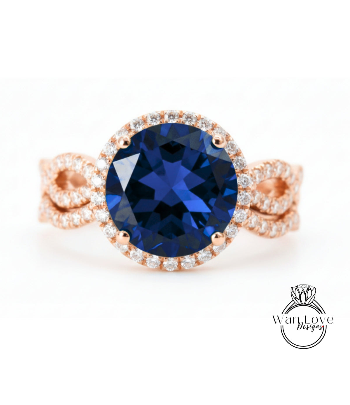 A close-up image of a large blue gemstone ring with a halo of smaller diamonds around the center stone.