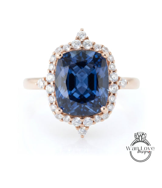 A stunning ring featuring a large blue gemstone surrounded by a halo of smaller diamonds, set in a rose gold band.