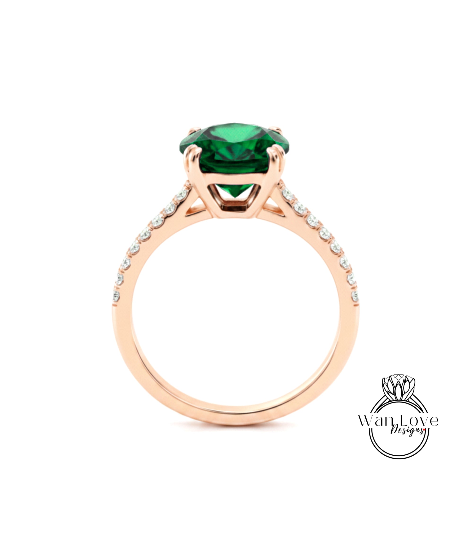 A rose gold engagement ring with a large green gemstone set in the center.