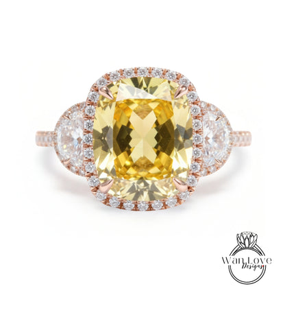 A large yellow gemstone ring with a halo of smaller diamonds around it, set in a rose gold band.