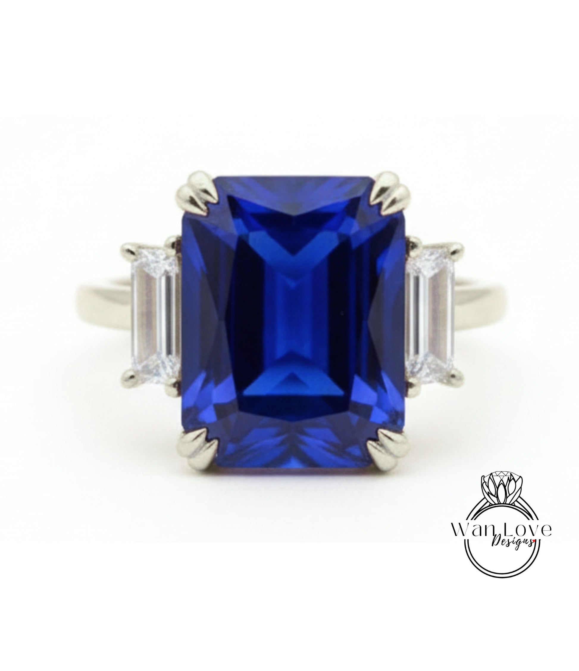 A large, blue gemstone ring with a diamond-encrusted band.