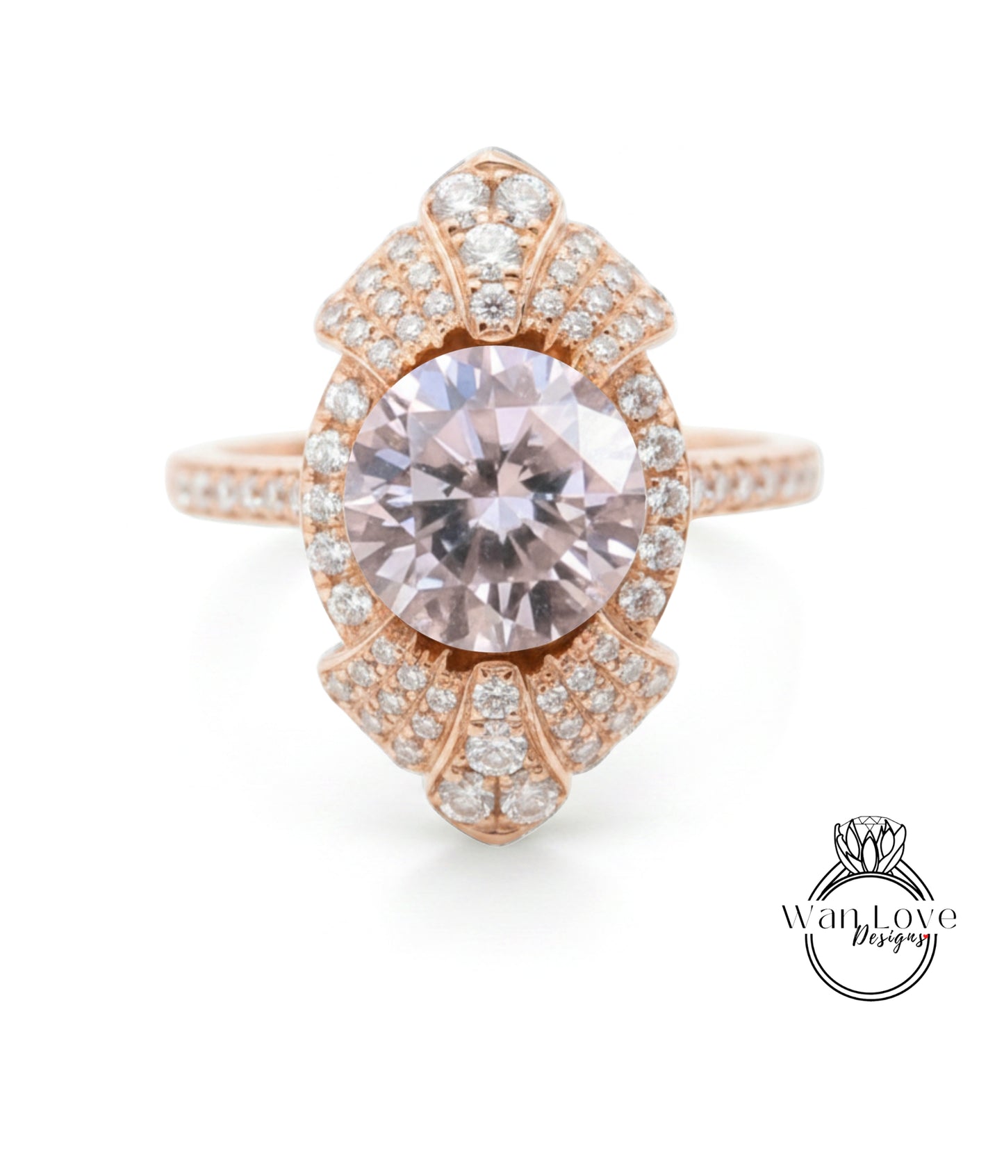 a beautiful pink gemstone ring with a large central gemstone surrounded by smaller diamonds.
