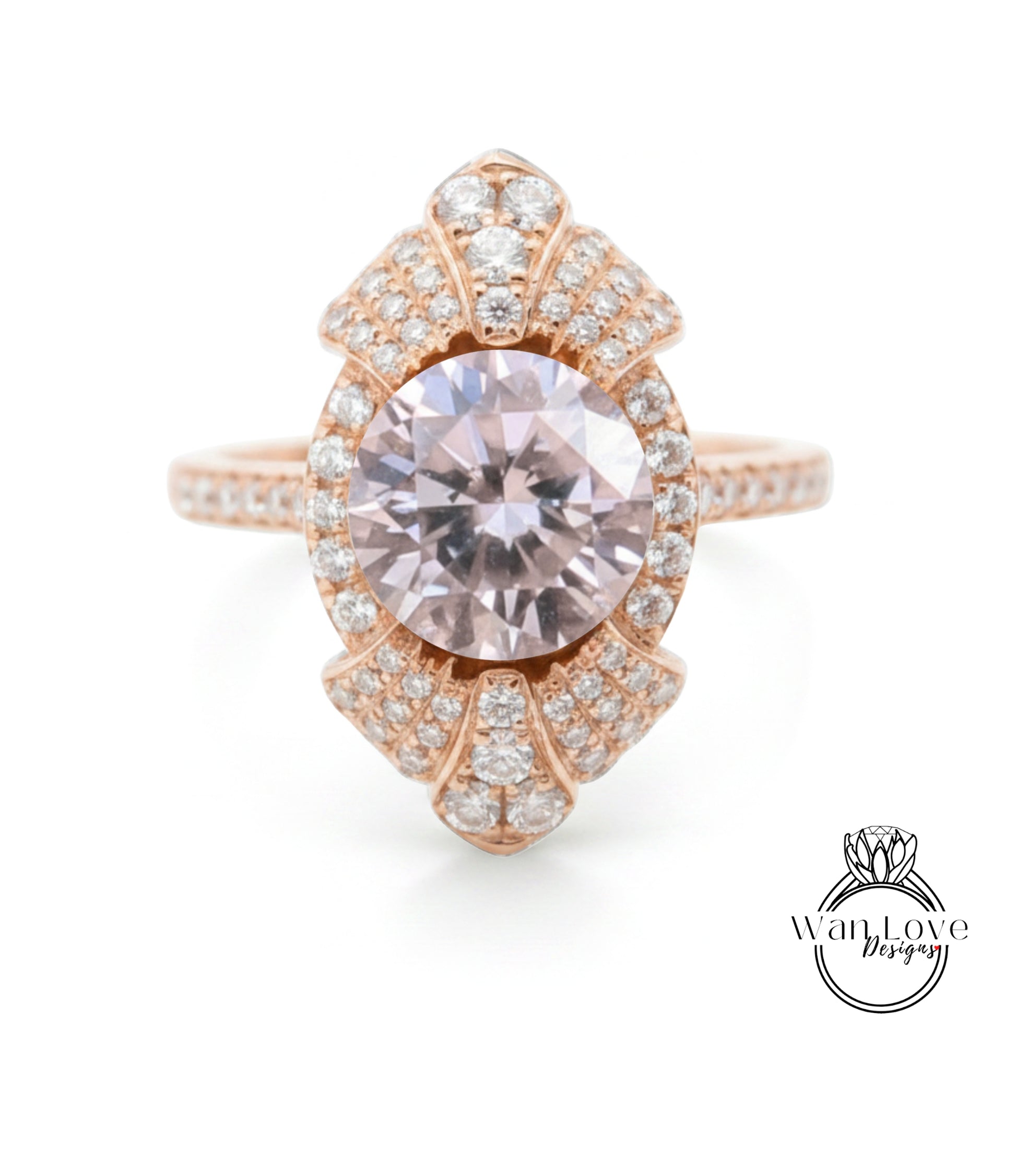 a beautiful pink gemstone ring with a large central gemstone surrounded by smaller diamonds.
