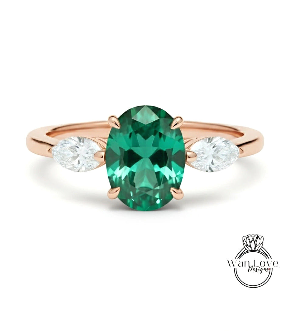 a beautiful engagement ring with a large oval-shaped green gemstone set in a rose gold band.