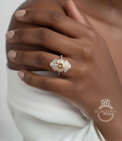 A close-up of a hand wearing a diamond ring on the ring finger.