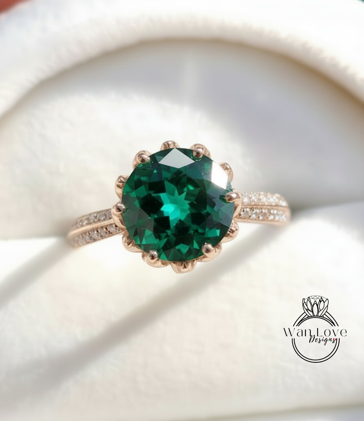 A close-up image of a gold ring with a large, round green gemstone set in the center.