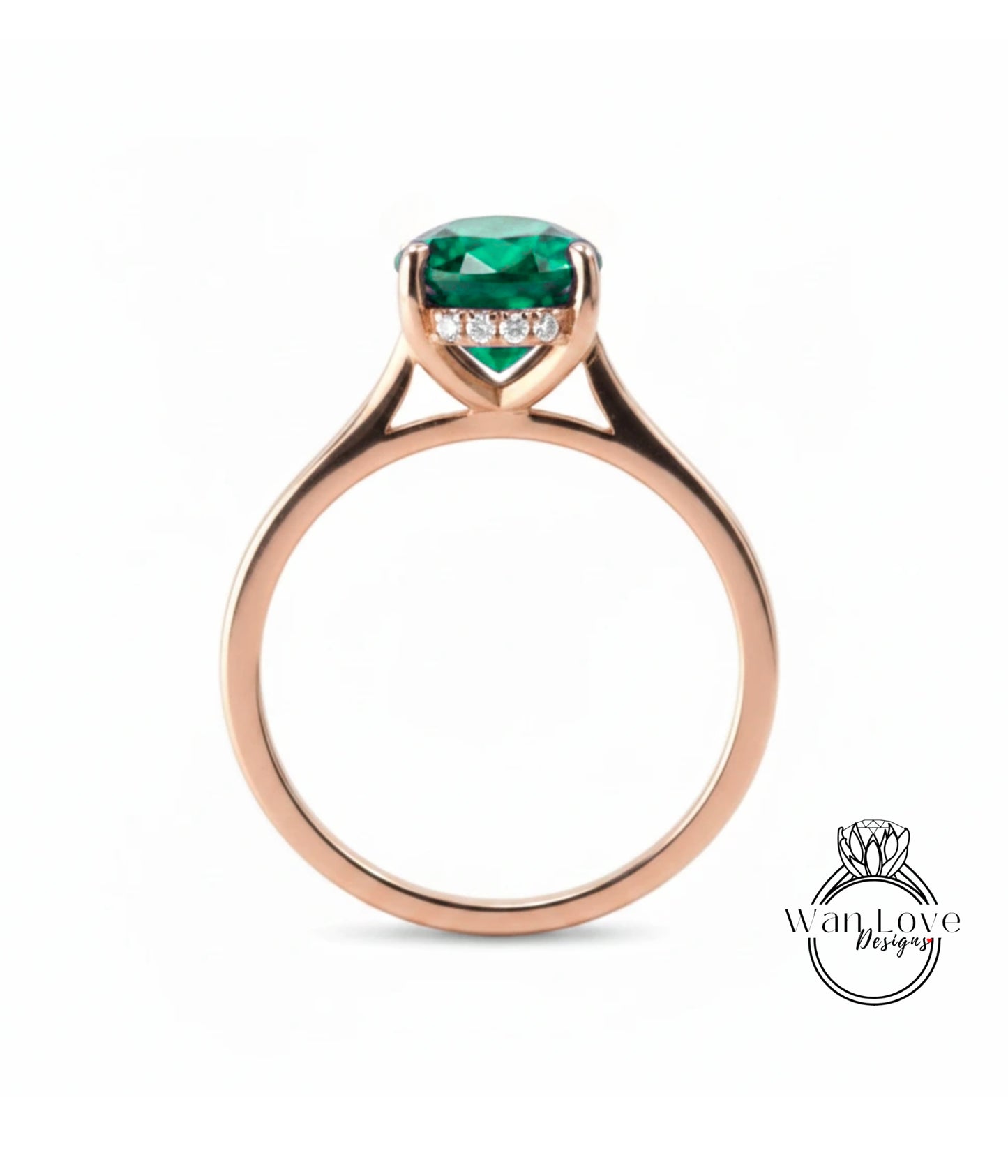 A rose gold engagement ring with a large, vibrant green gemstone set in the center.