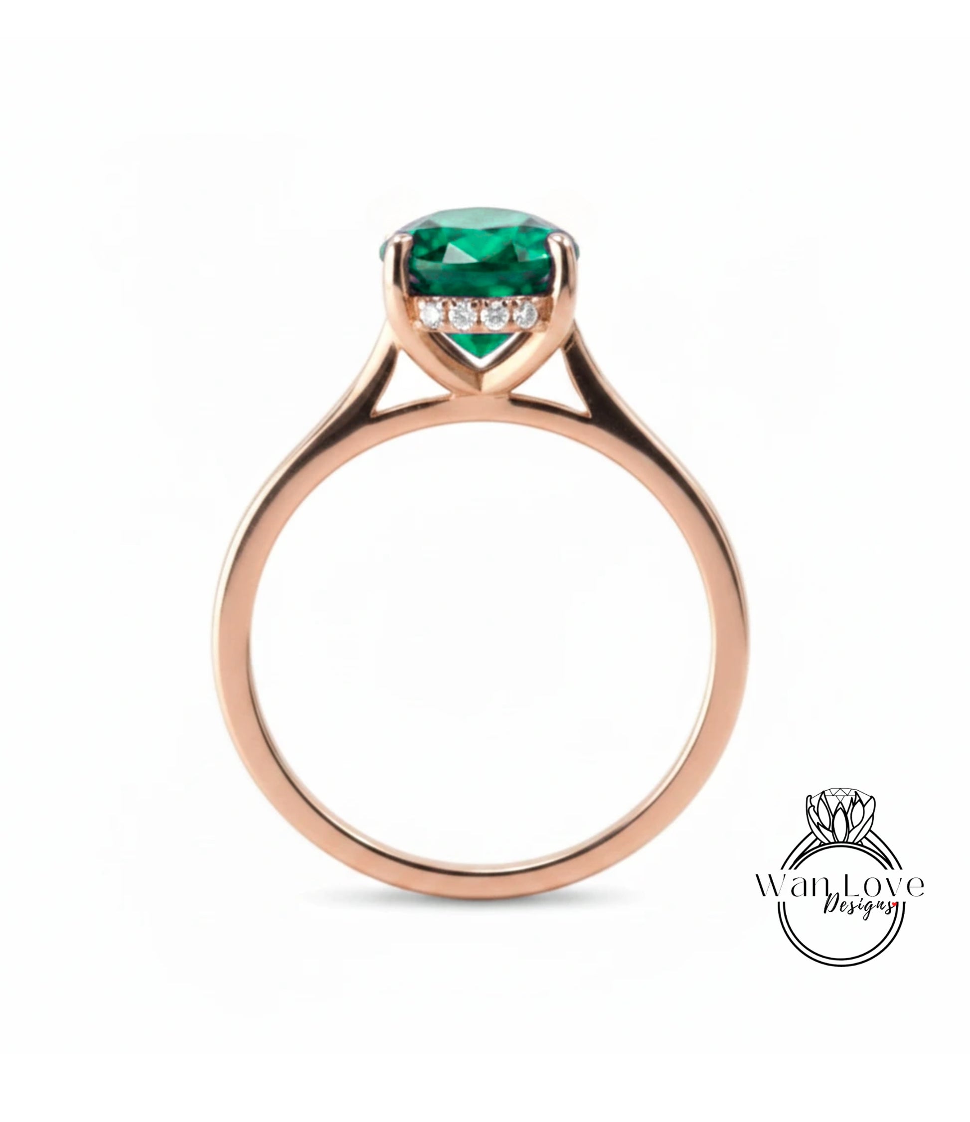 A rose gold engagement ring with a large, vibrant green gemstone set in the center.