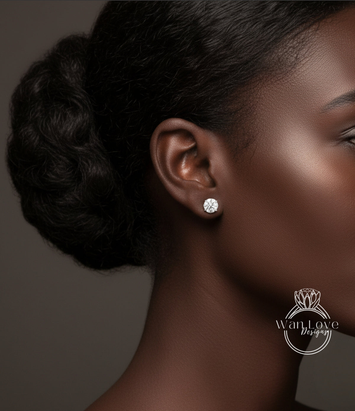 A close-up of a woman's face, focusing on her earrings and hair.
