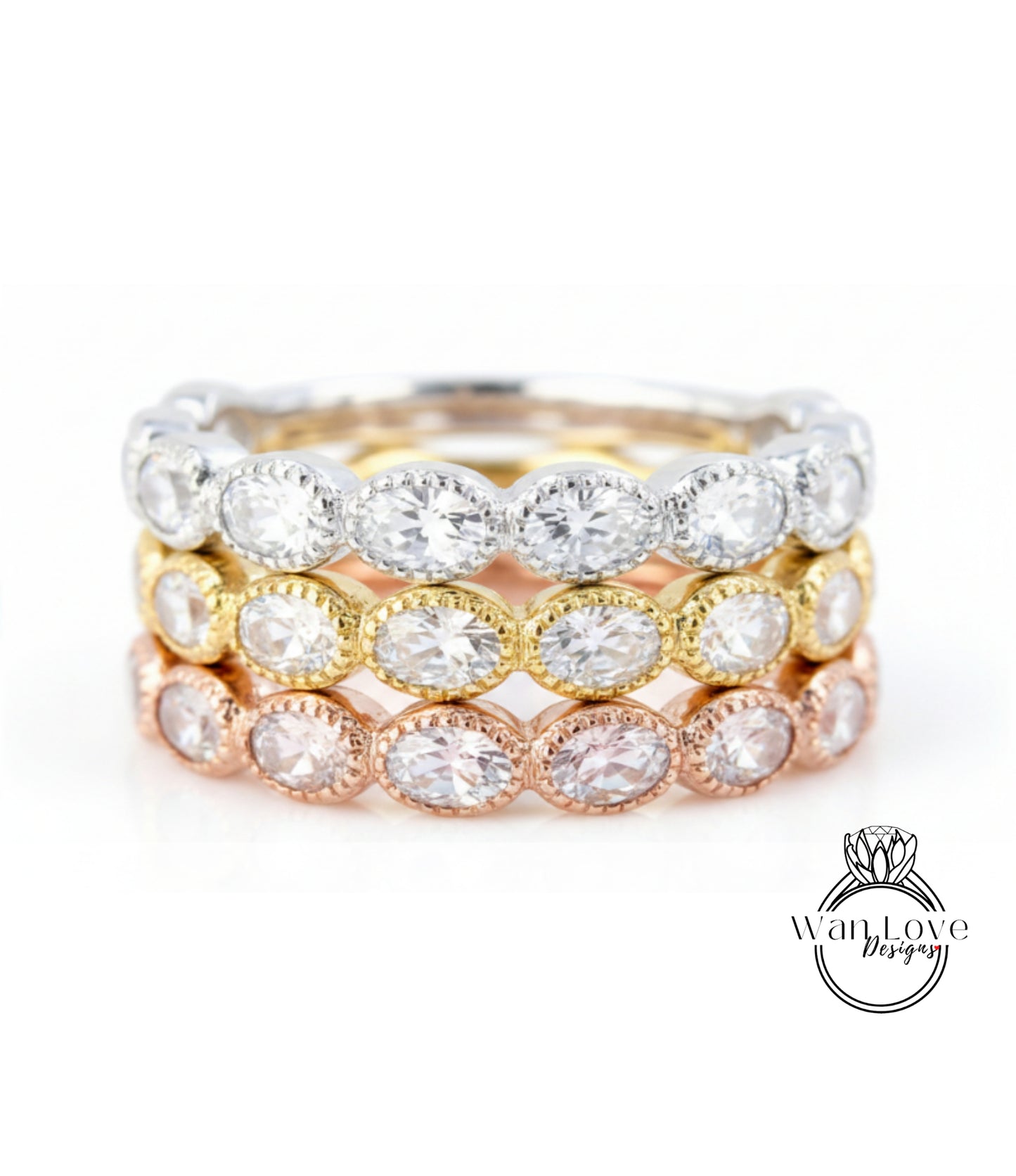 A close-up image of a ring with multiple layers of rings, each featuring a large, clear gemstone.