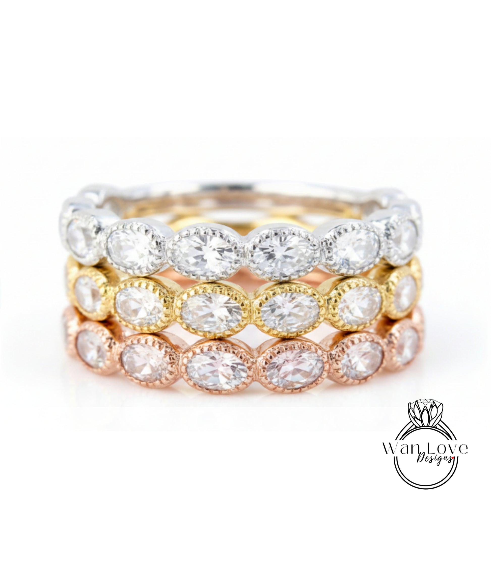 A close-up image of a ring with multiple layers of rings, each featuring a large, clear gemstone.