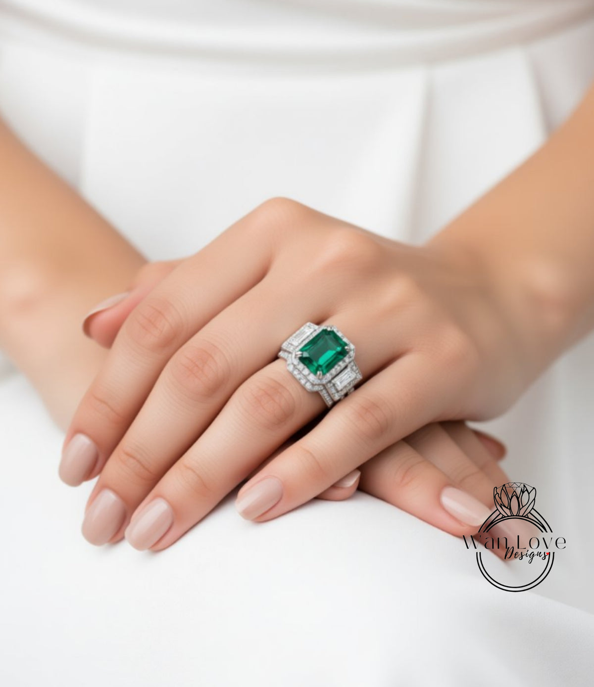 A close-up of a person's hand wearing a large, ornate ring with a green gemstone.