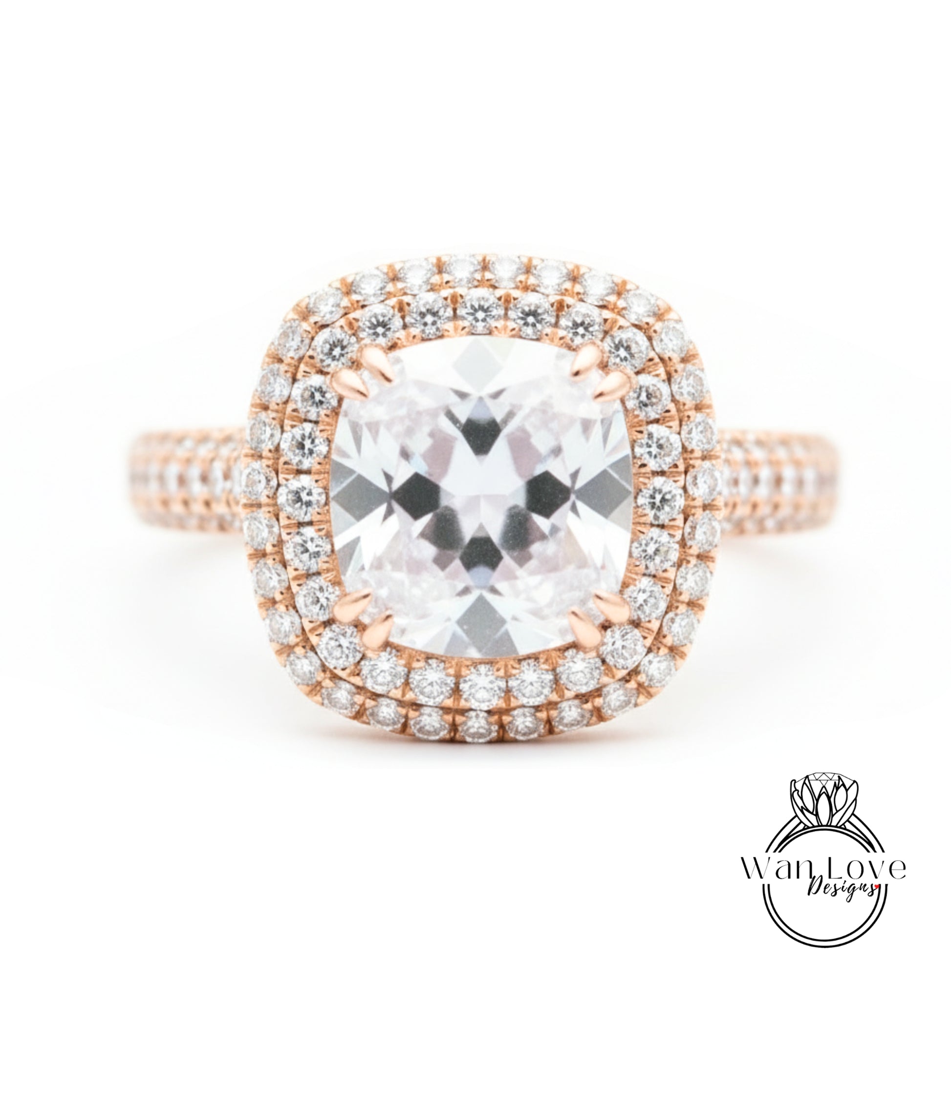 A close-up image of a diamond engagement ring with a large central diamond surrounded by smaller diamonds set in a halo of smaller diamonds.