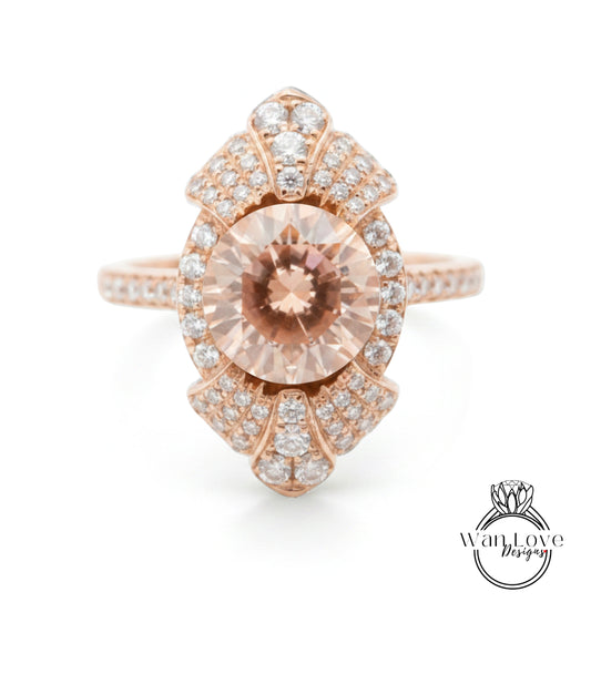 a beautiful rose gold ring with a large, round, light pink gemstone at the center. The ring is adorned with numerous small diamonds around the edges, creating a stunning and elegant design.