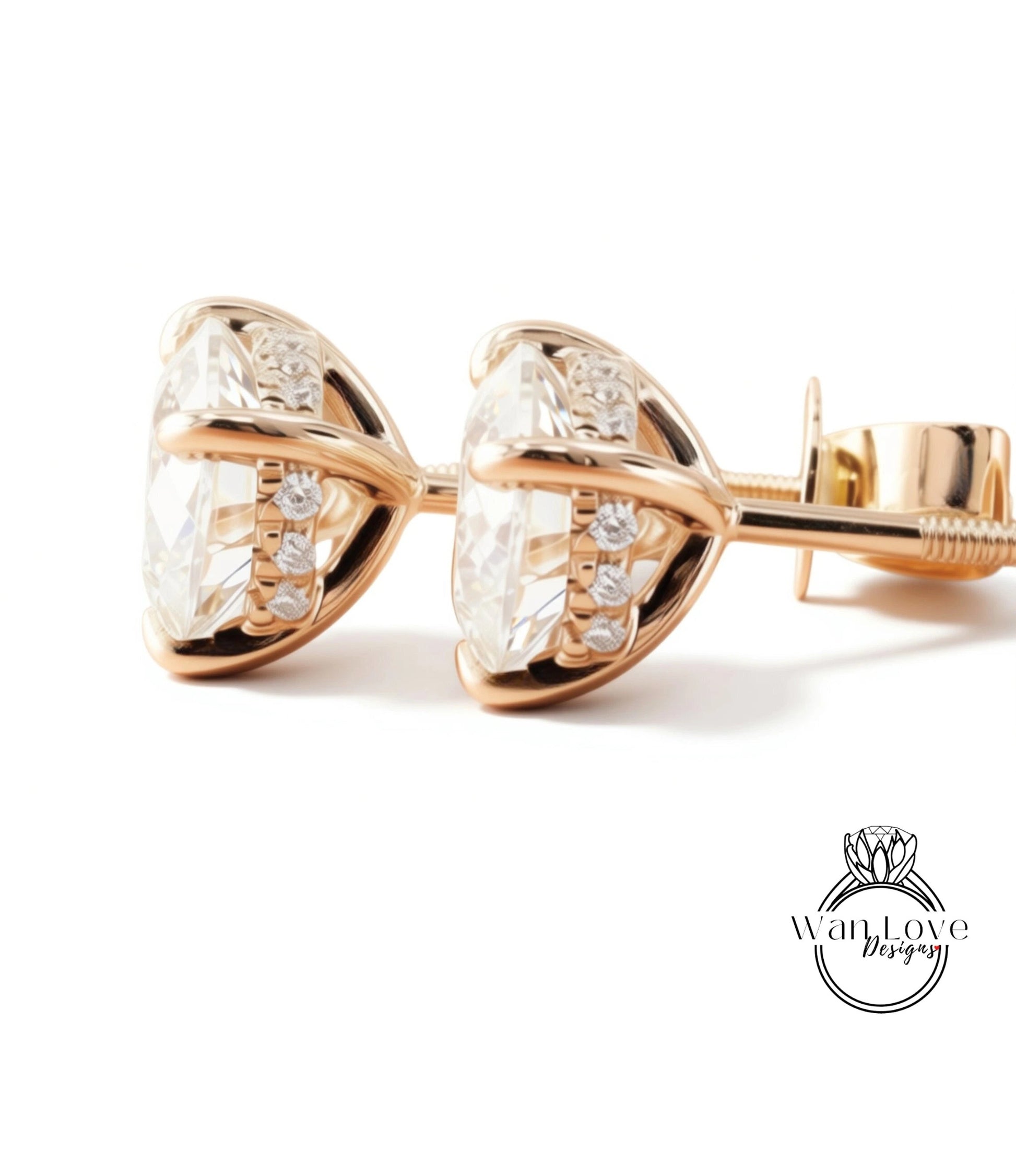 A pair of elegant gold earrings with clear gemstones, displayed on a white background.