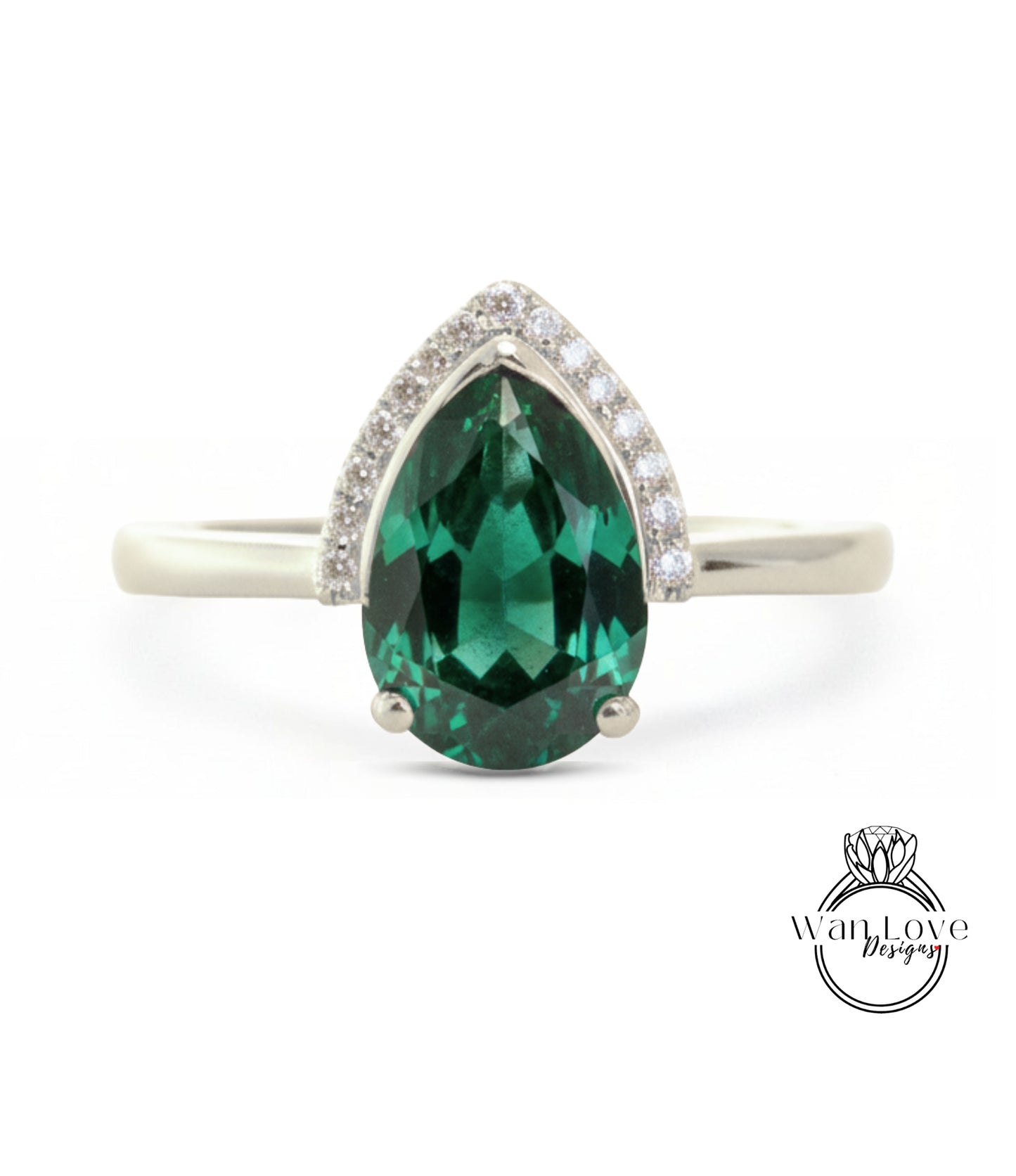 A silver ring with a large, green gemstone in the center.