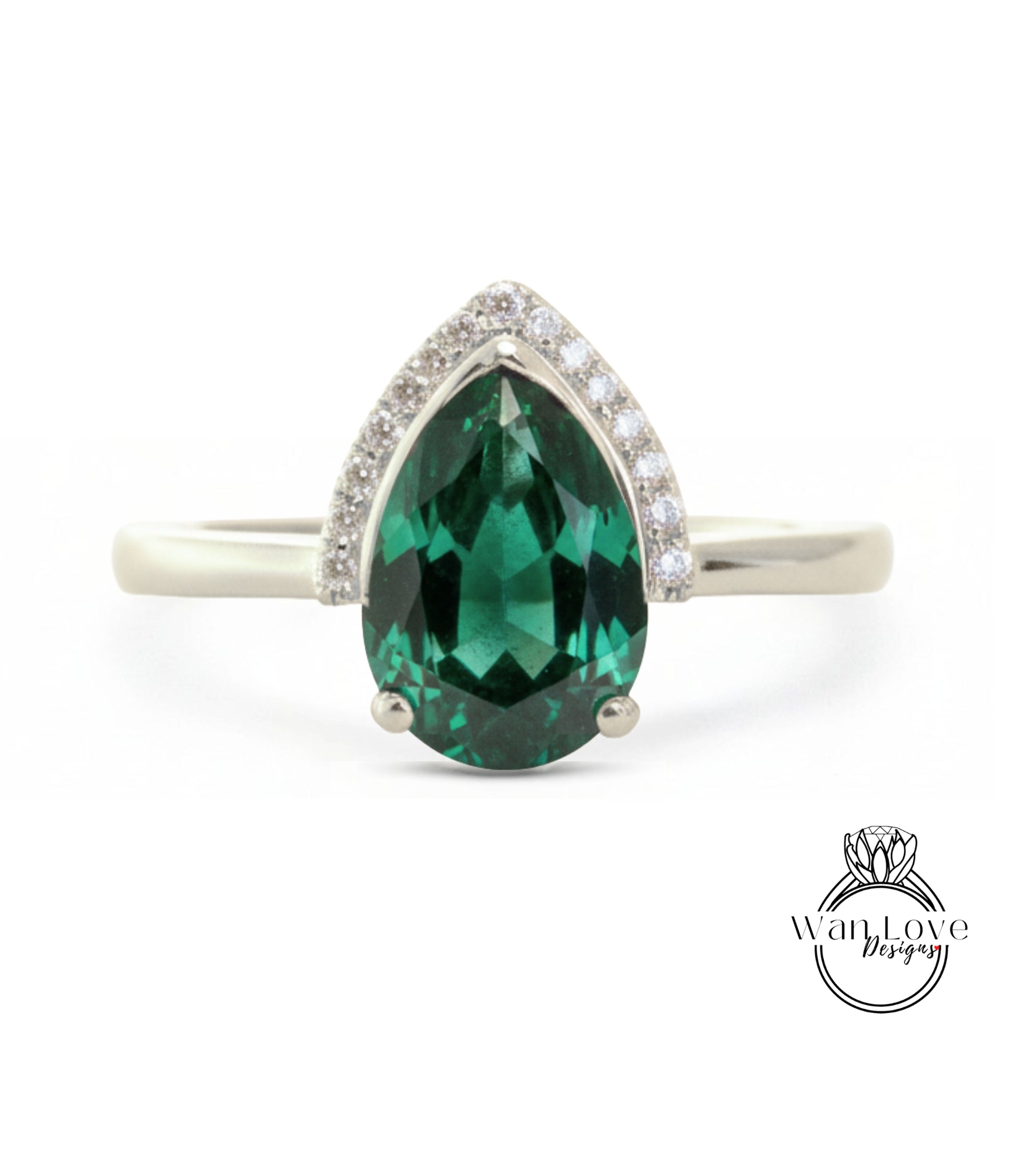 A silver ring with a large, green gemstone in the center.