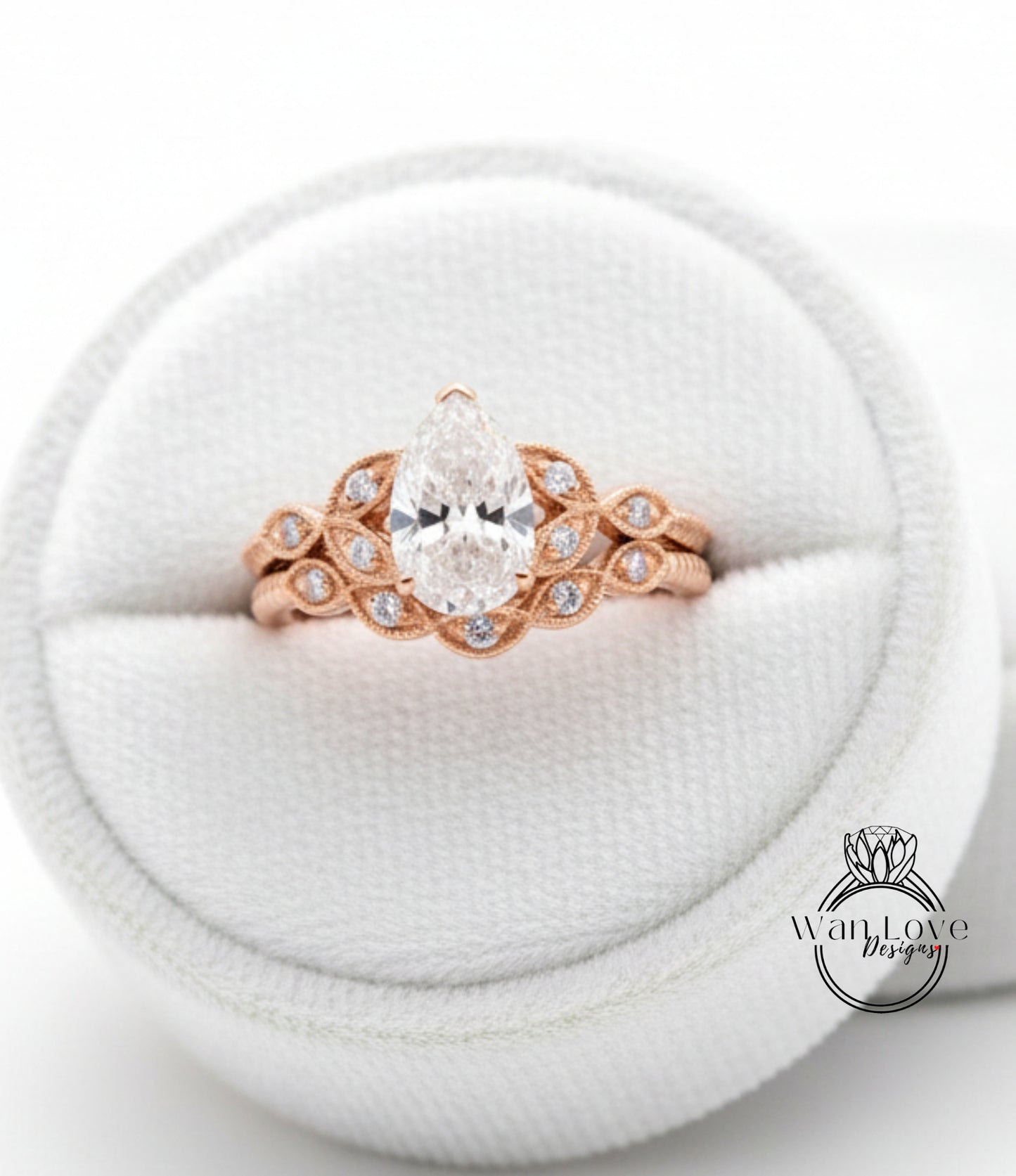 A close-up image of a beautiful engagement ring displayed in a white jewelry box.