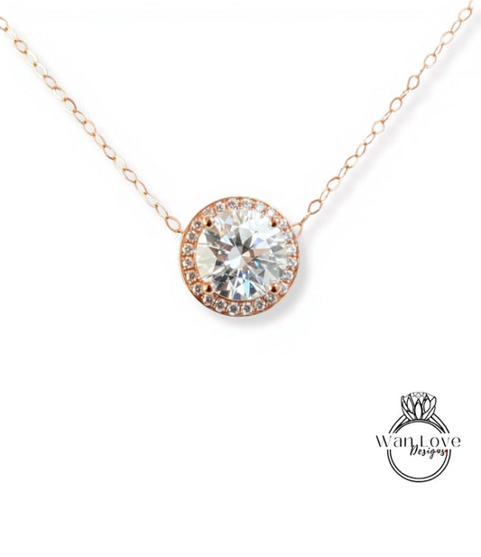 A necklace with a large, clear gemstone pendant in the center, surrounded by a halo of smaller diamonds.