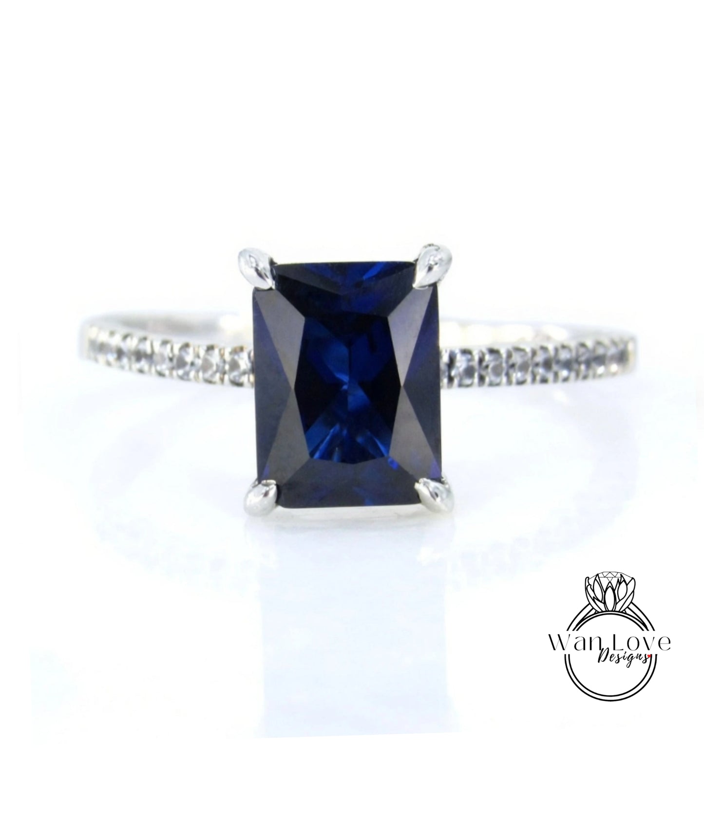 A ring with a large blue gemstone, likely a sapphire, set in a silver band.