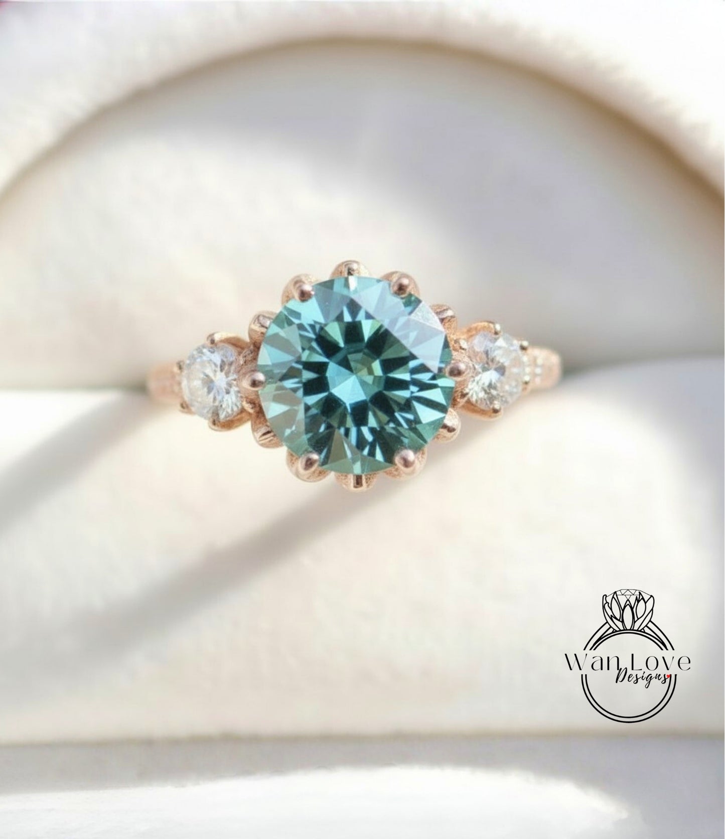 A close-up image of a gold ring with a large blue gemstone, showcasing the intricate details and craftsmanship of the jewelry.