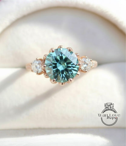 A close-up image of a gold ring with a large blue gemstone, showcasing the intricate details and craftsmanship of the jewelry.