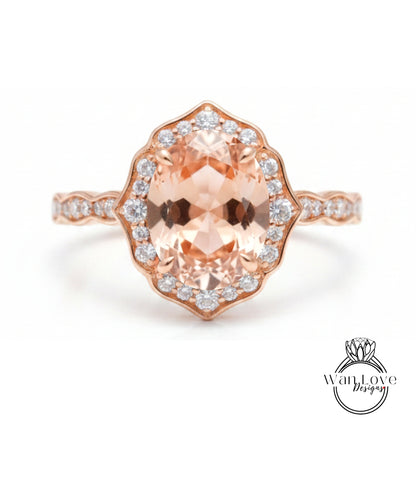 a beautiful rose gold ring with a large oval-shaped gemstone set in the center, surrounded by smaller diamonds.