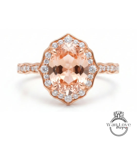 a beautiful rose gold ring with a large oval-shaped gemstone set in the center, surrounded by smaller diamonds.