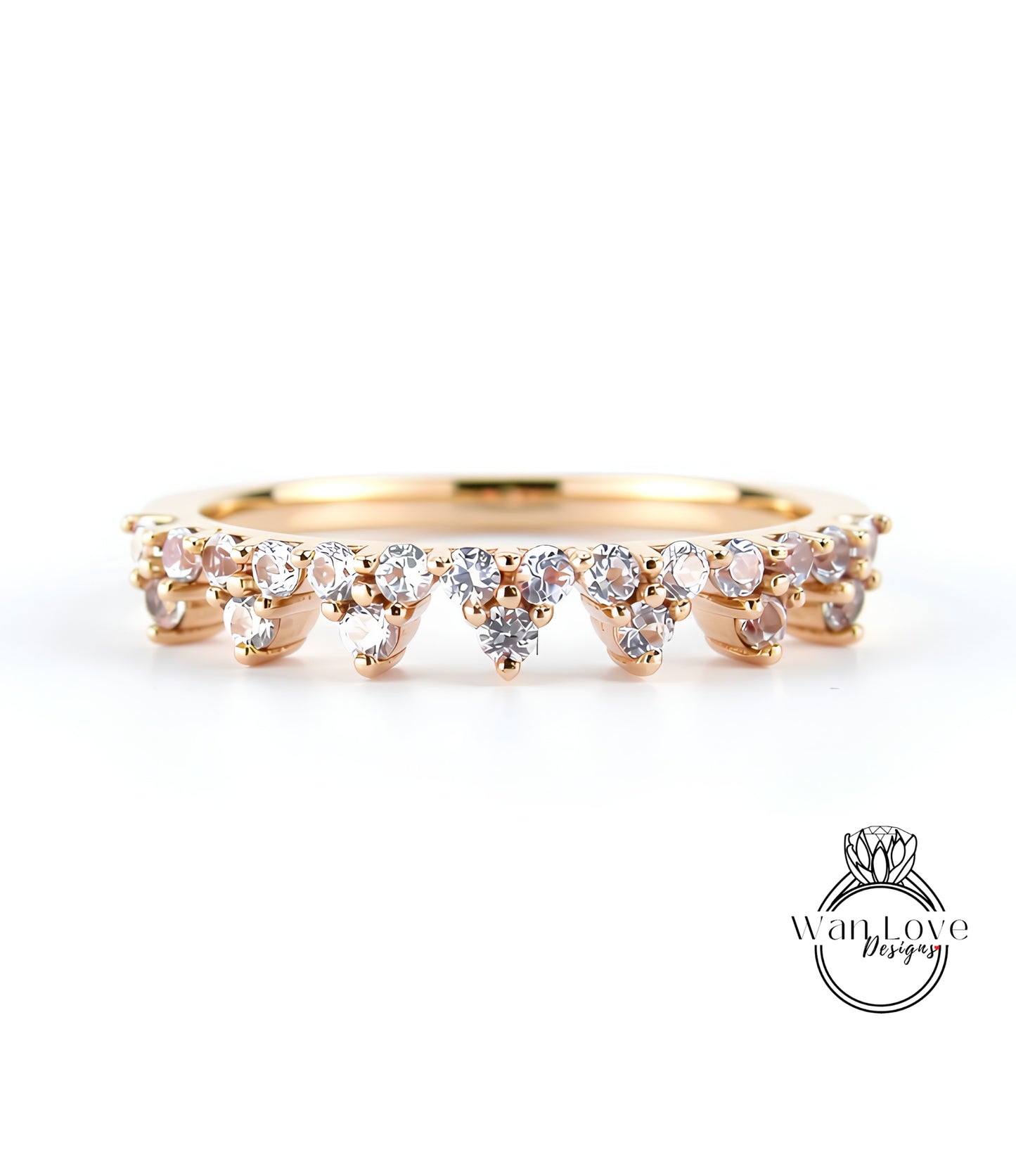 A gold ring with a row of small diamonds set in the center, showcasing the intricate design and craftsmanship of the piece.