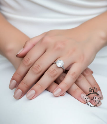 A close-up of a person's hands wearing a large diamond engagement ring.
