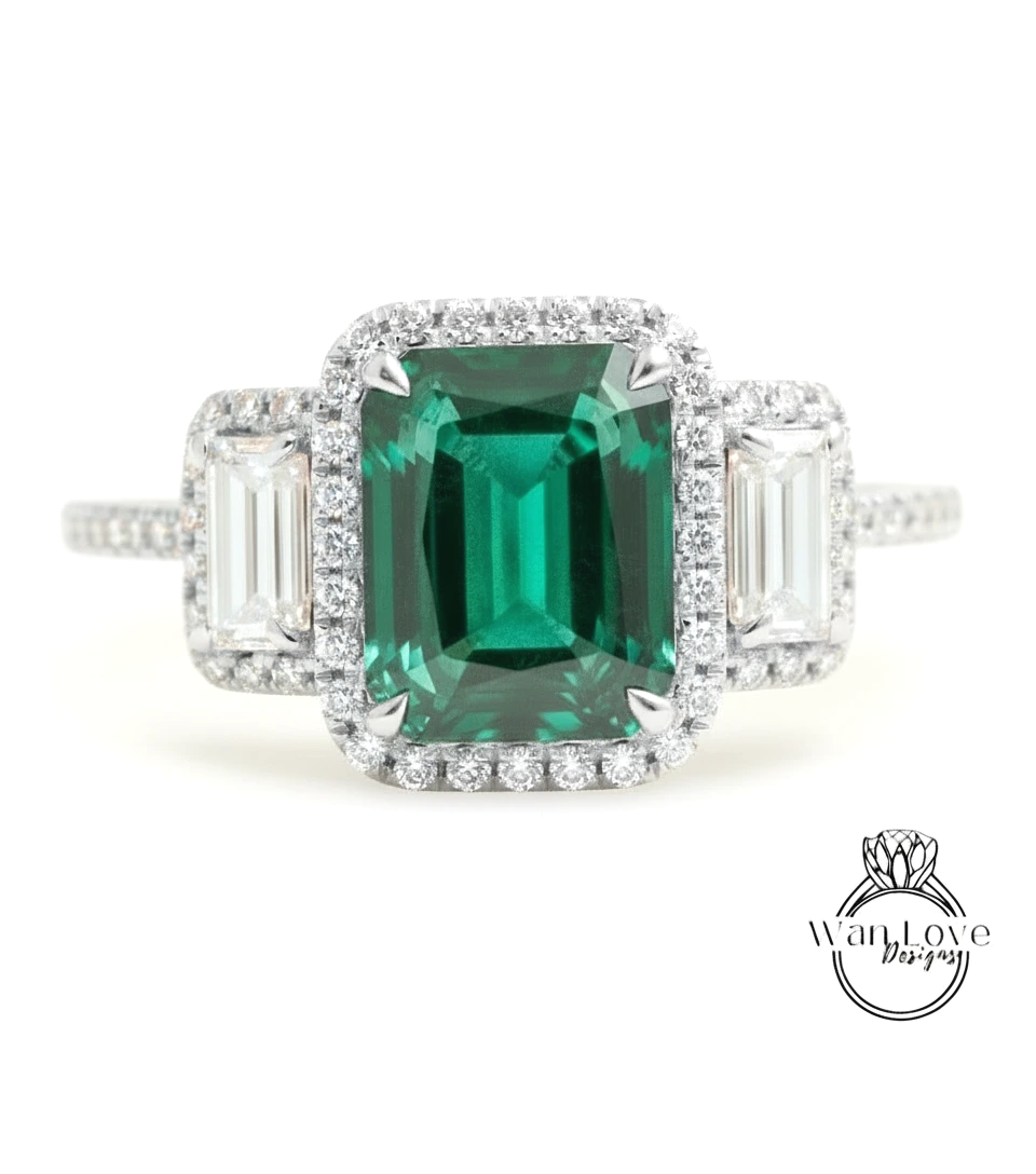 A stunning engagement ring with a large, vibrant green gemstone surrounded by smaller diamonds.