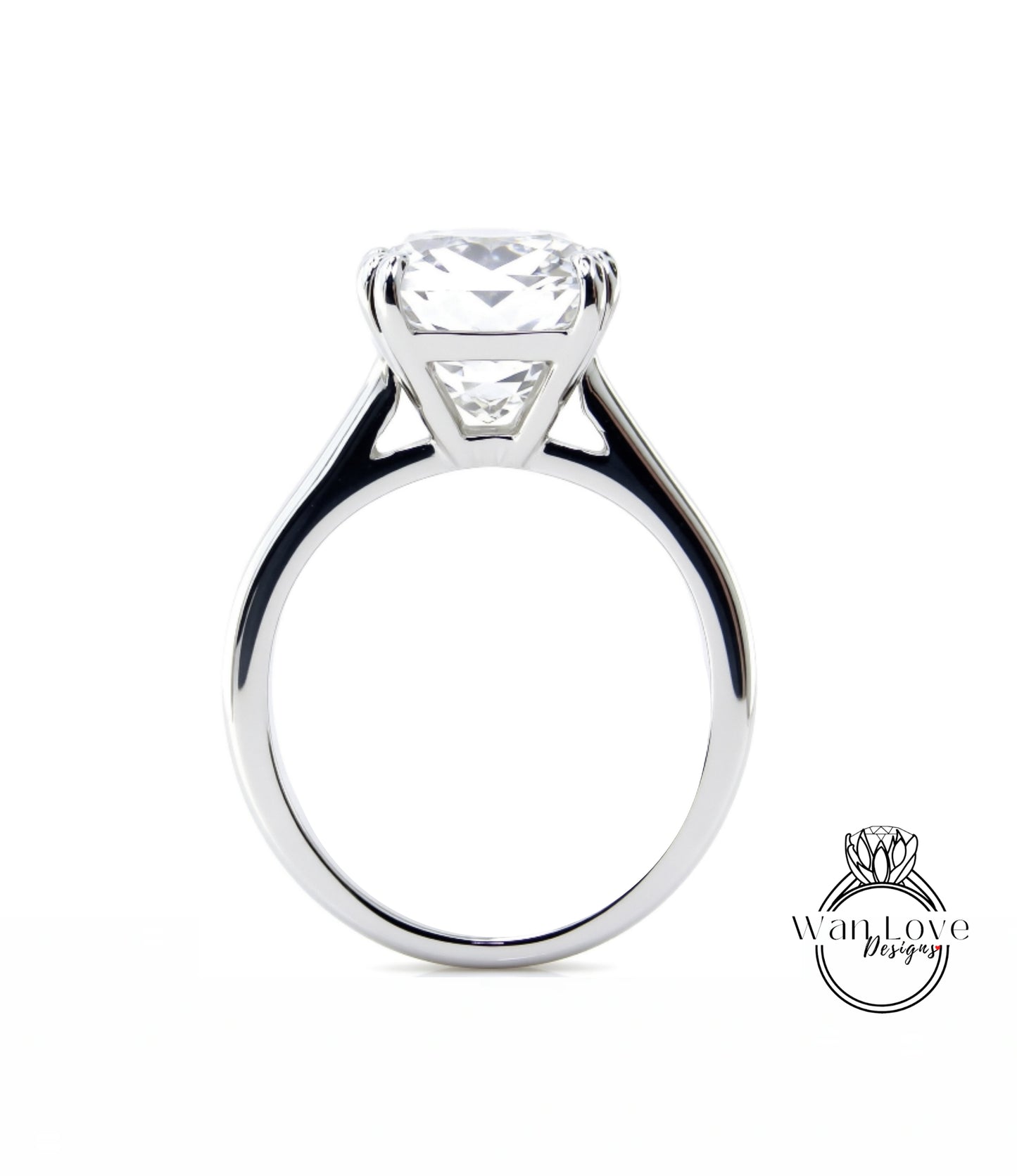 A large, elegant diamond engagement ring with a prominent center stone.