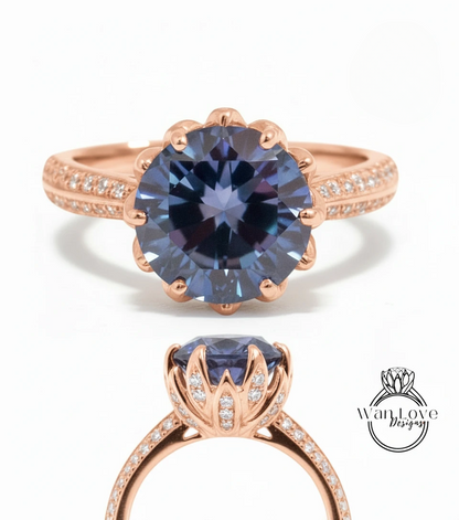 a beautiful rose gold ring with a large blue gemstone set in the center. The ring has a scalloped edge and is adorned with small diamonds around the band.