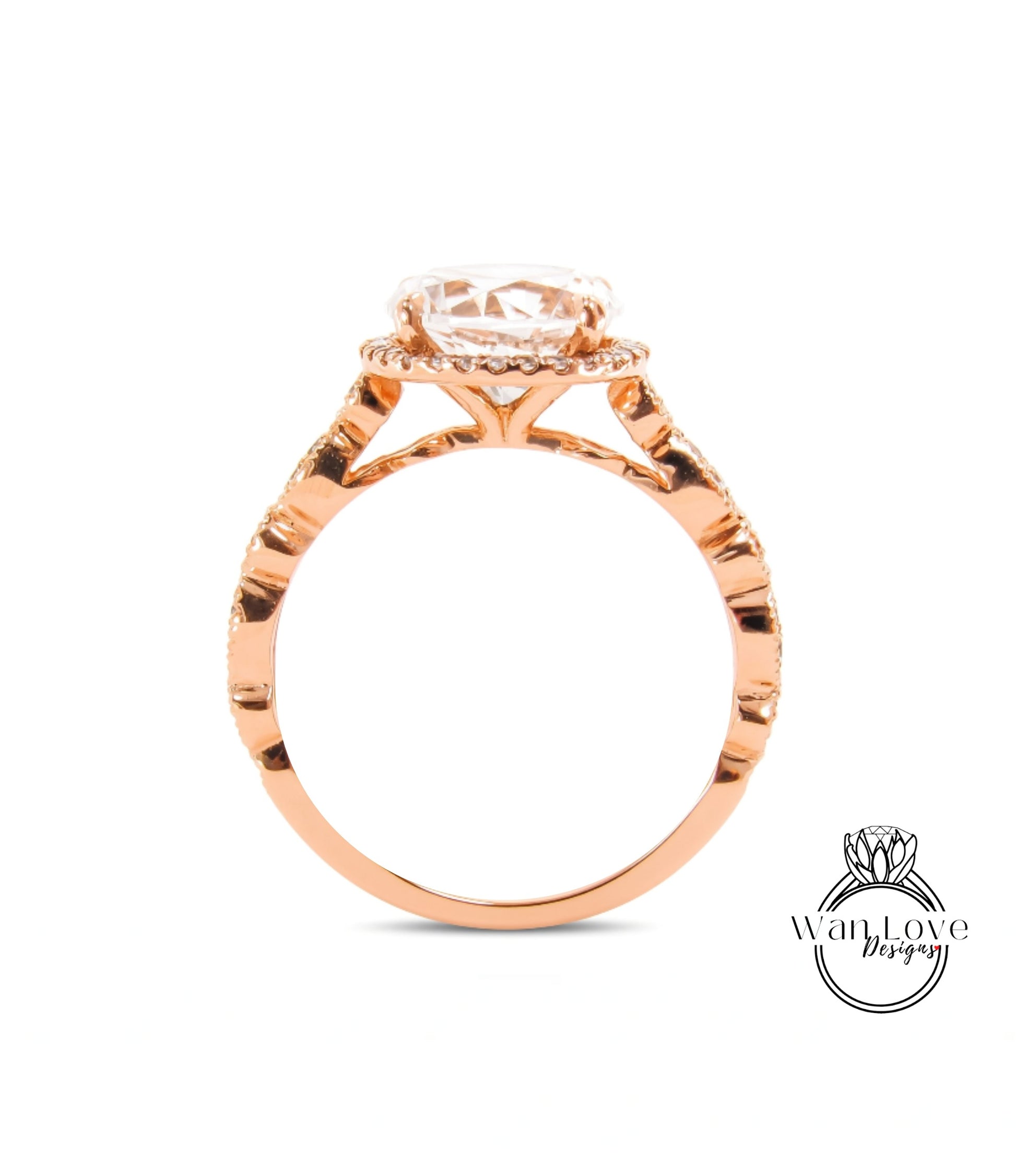 A rose gold engagement ring with a large central diamond and a halo of smaller diamonds around the center stone.