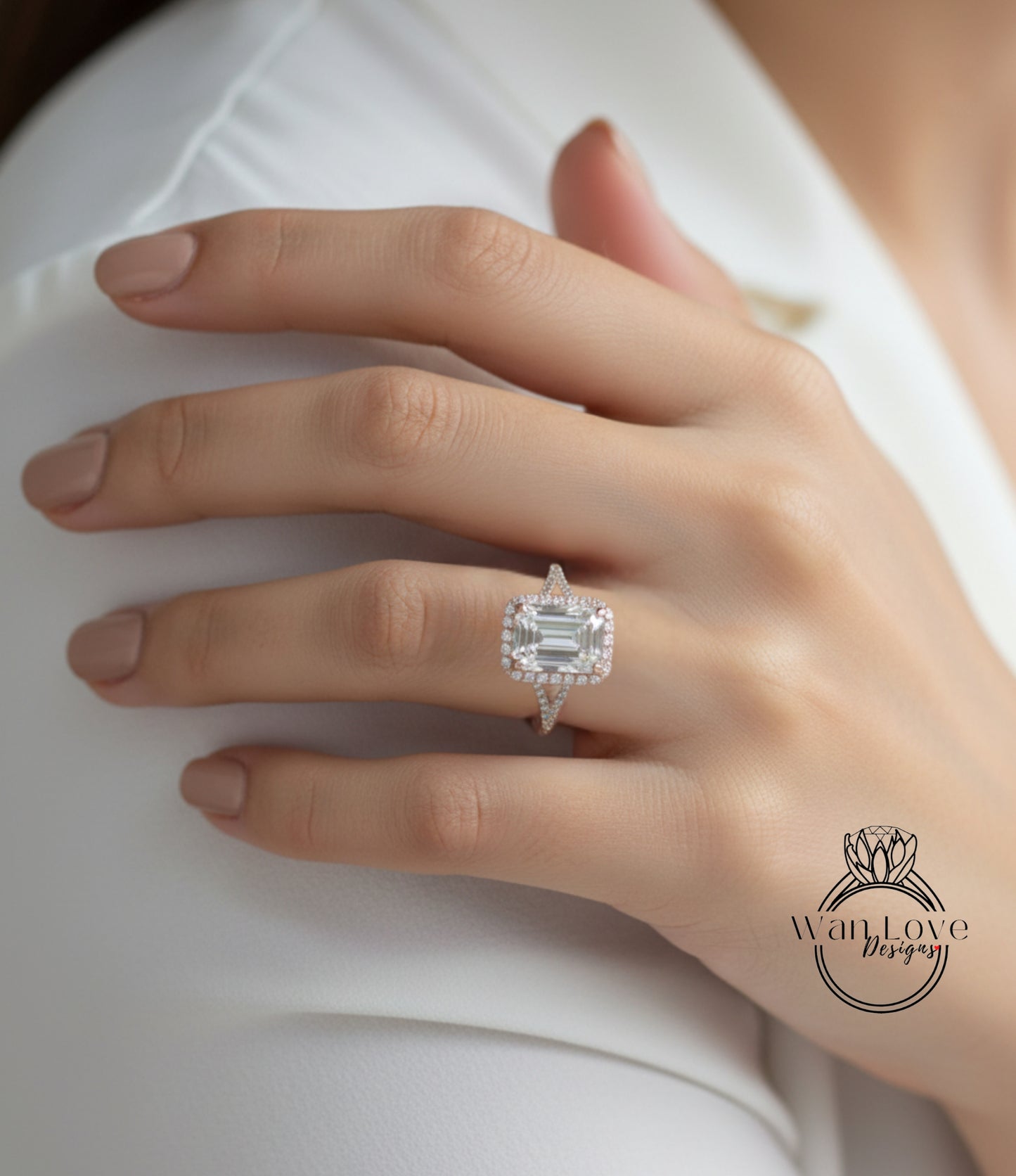 A close-up of a person's hand wearing a large, diamond-encrusted ring on the ring finger.