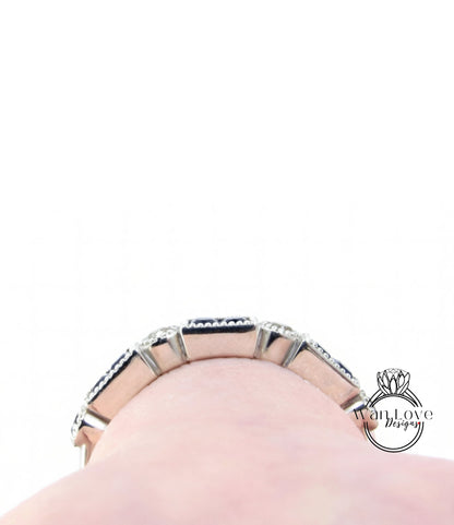 A close-up view of a silver bracelet with a row of small diamonds on it, worn on a person's wrist.