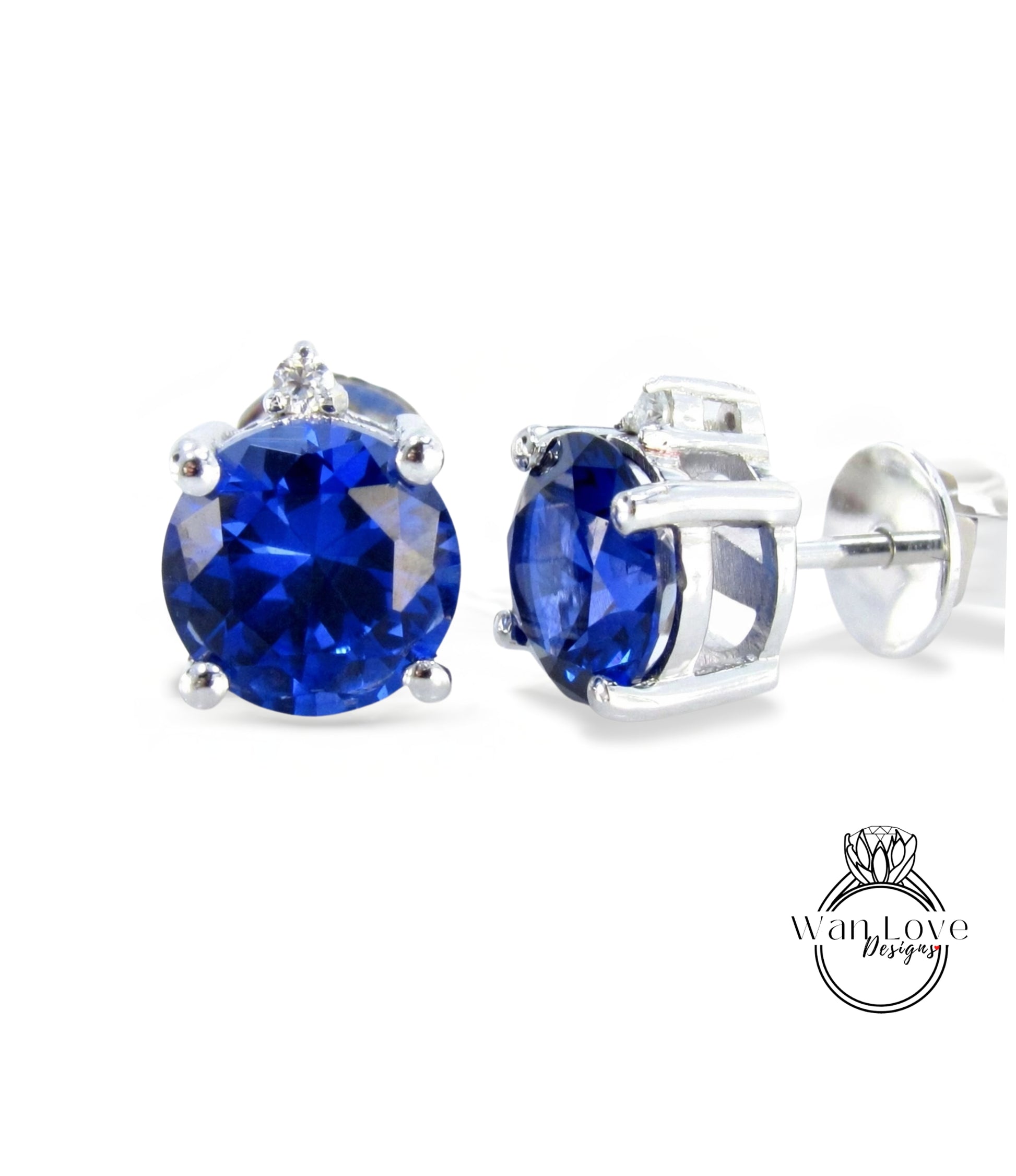 A pair of elegant earrings with large blue gemstones set in silver.