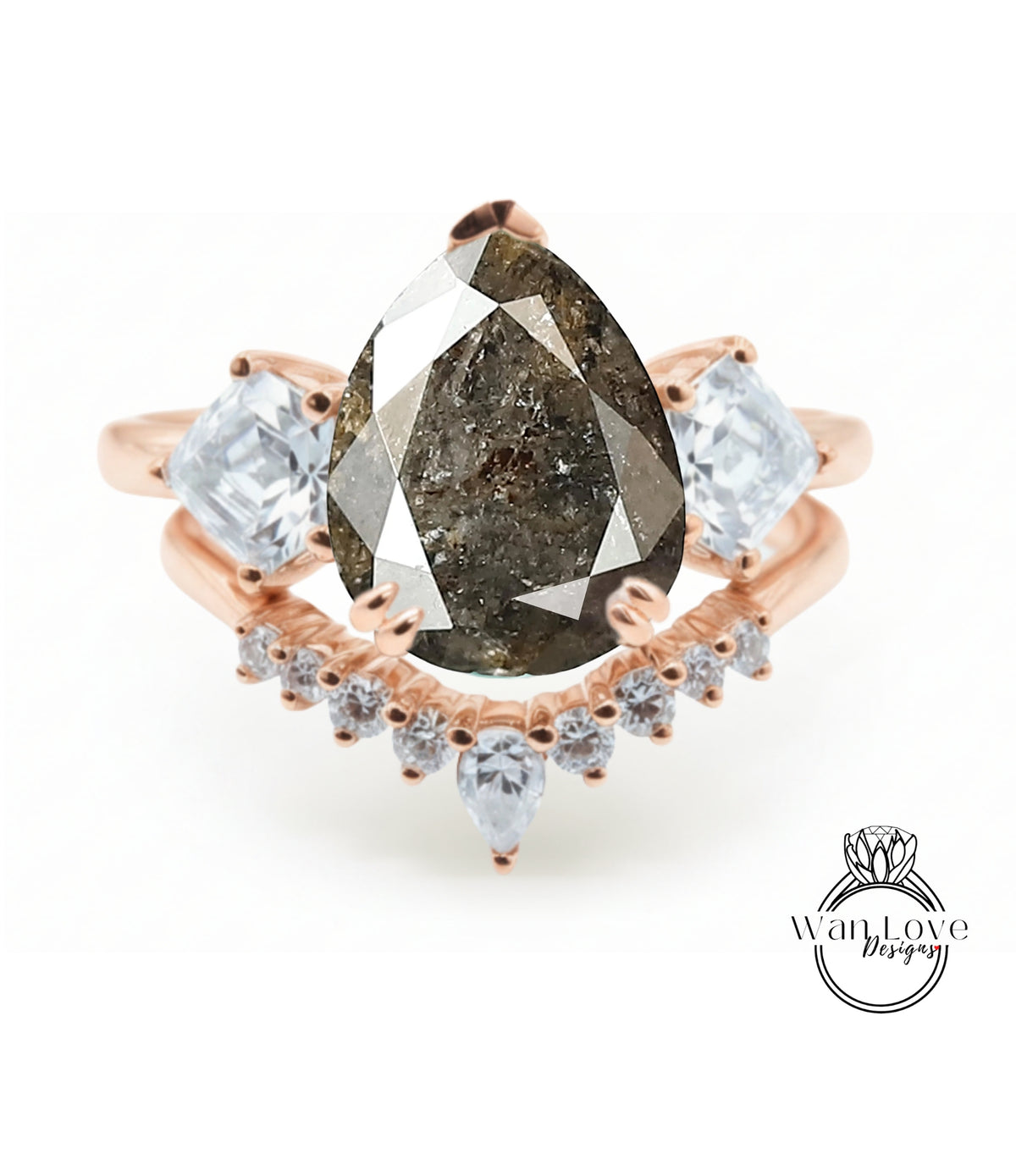 a ring with a large pear-shaped diamond as the centerpiece, surrounded by smaller diamonds and a rose gold band.