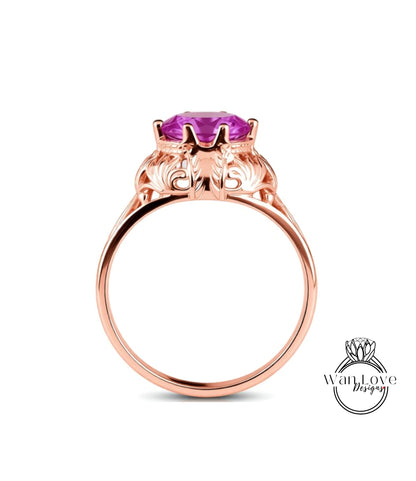 A rose gold ring with a large purple gemstone set in the center.