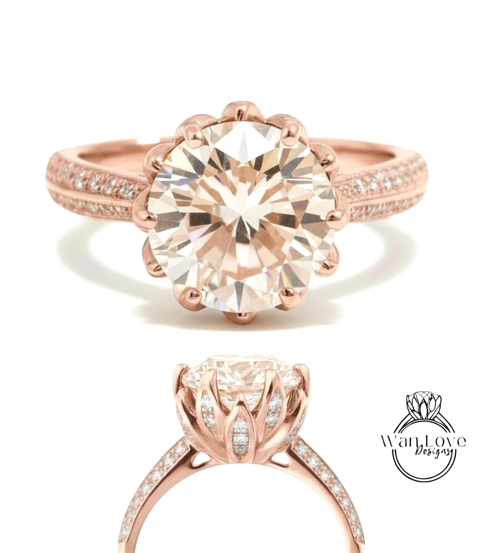 a beautiful rose gold engagement ring with a large, round diamond set in the center. The ring has a scalloped band and is adorned with small diamonds around the band.