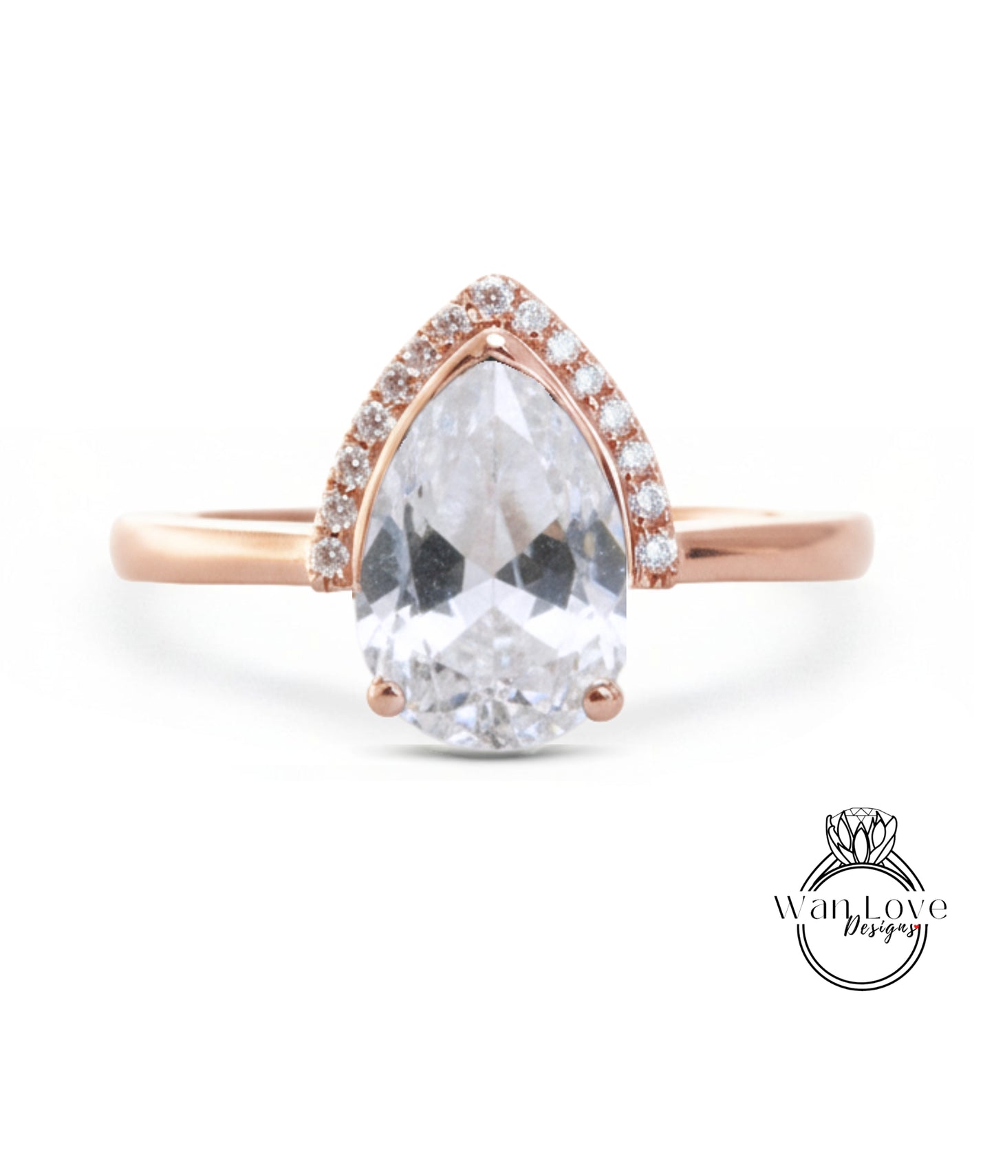 A rose gold ring with a large, clear pear-shaped gemstone set in the center, surrounded by smaller diamonds.
