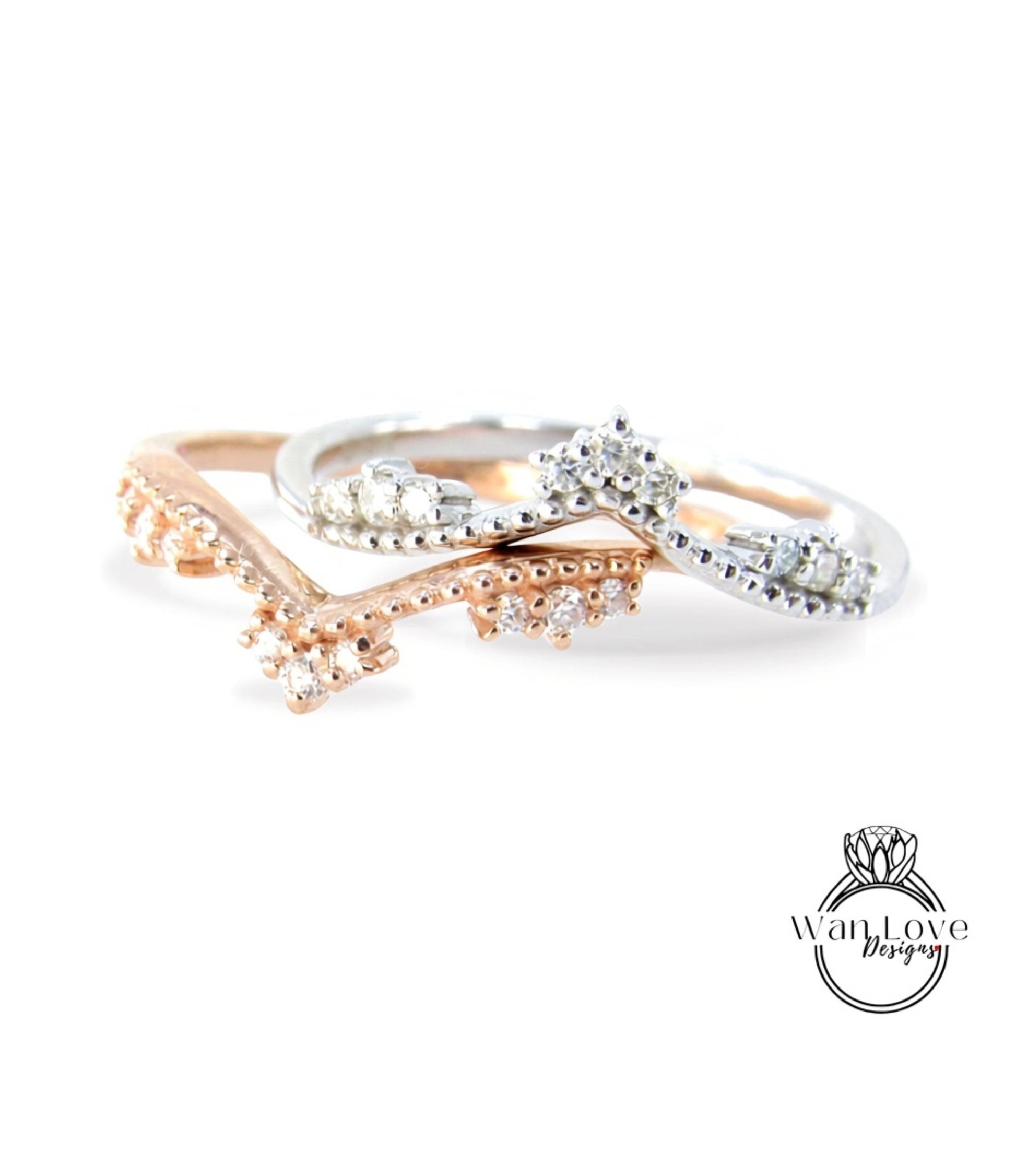 A close-up image of three rings with diamond-encrusted designs, showcasing the intricate details and craftsmanship of the jewelry.