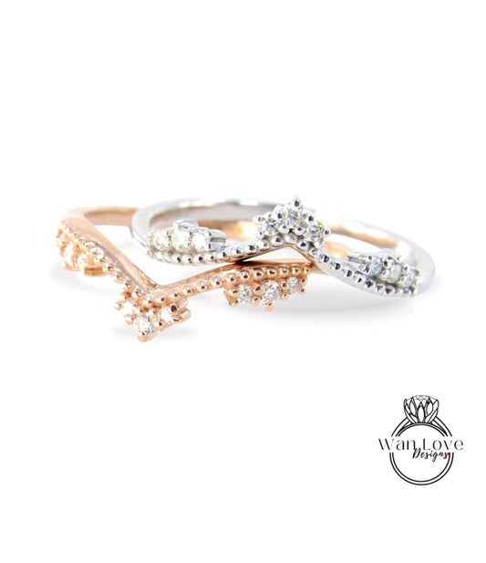 A close-up image of three rings with diamond-encrusted designs, showcasing the intricate details and craftsmanship of the jewelry.