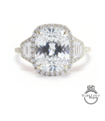A large, clear diamond engagement ring with a halo of smaller diamonds around the center stone.