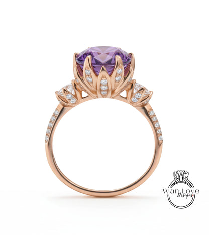 A gold ring with a large purple gemstone, likely an amethyst, surrounded by smaller diamonds.