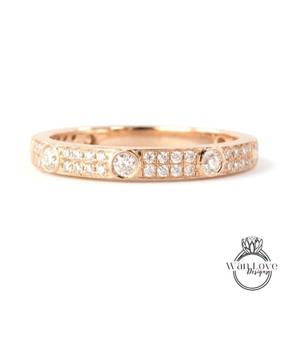 A gold ring with a row of small diamonds set in the band.