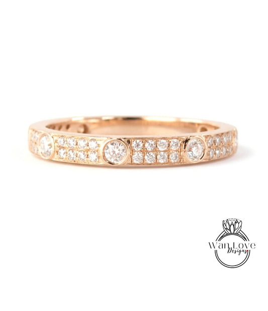 A gold ring with a row of small diamonds set in the band.