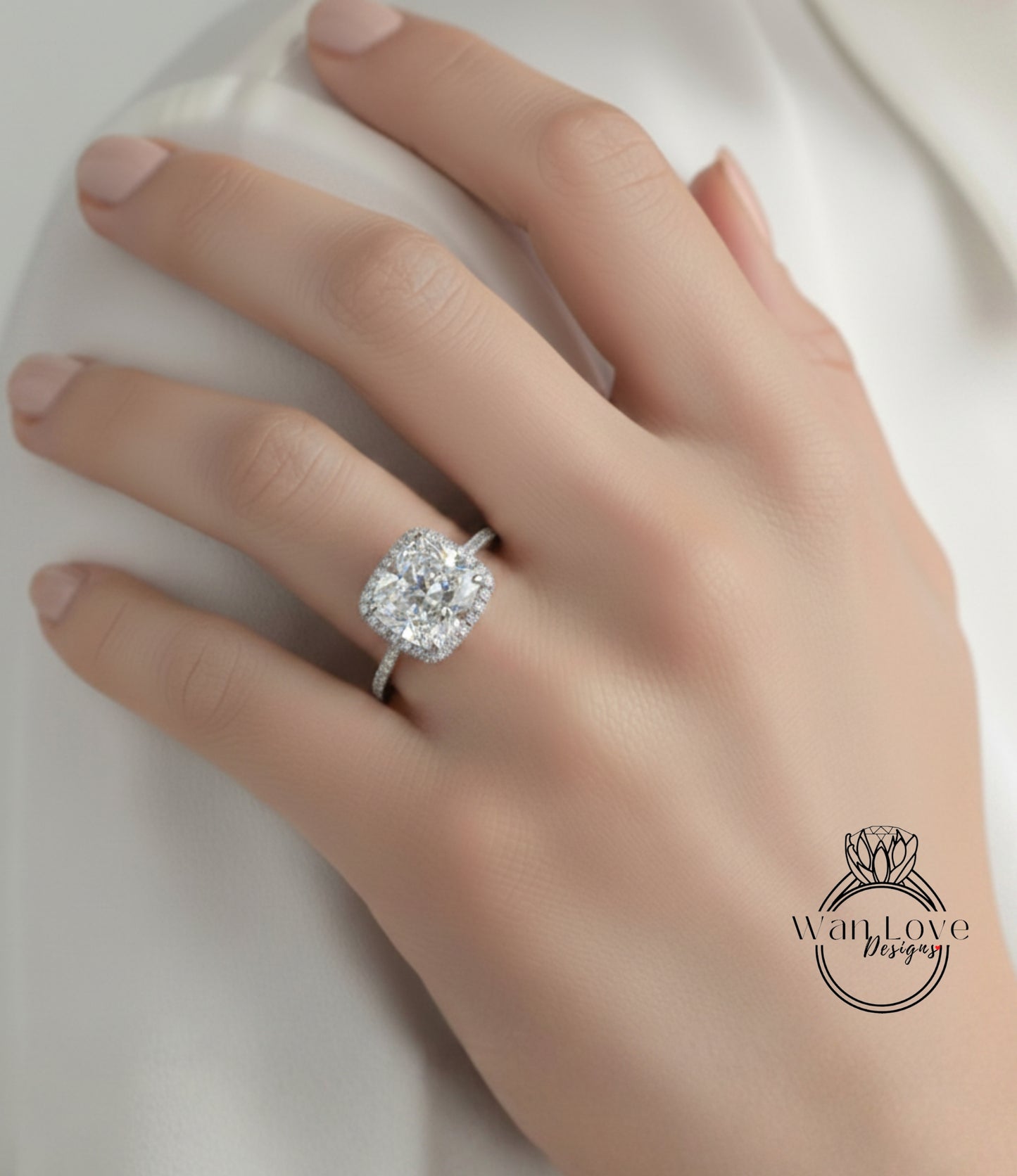 A close-up of a hand wearing a large diamond engagement ring.