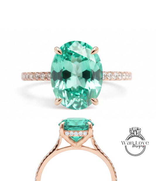 a beautiful engagement ring with a large oval-shaped gemstone set in a rose gold band.